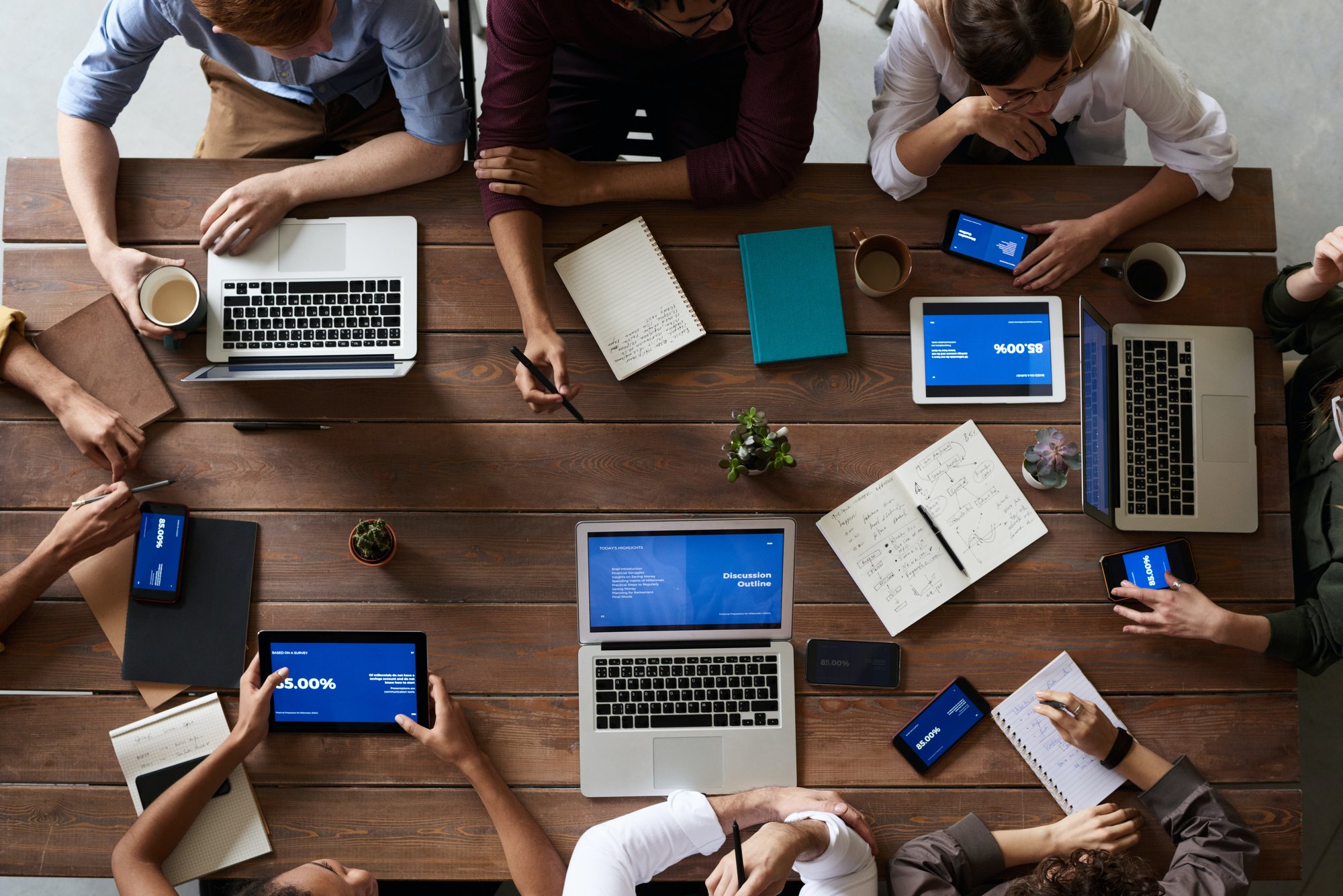 top-view-people-working-wood-table